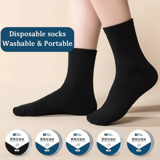 Black disposable travel socks worn on feet
